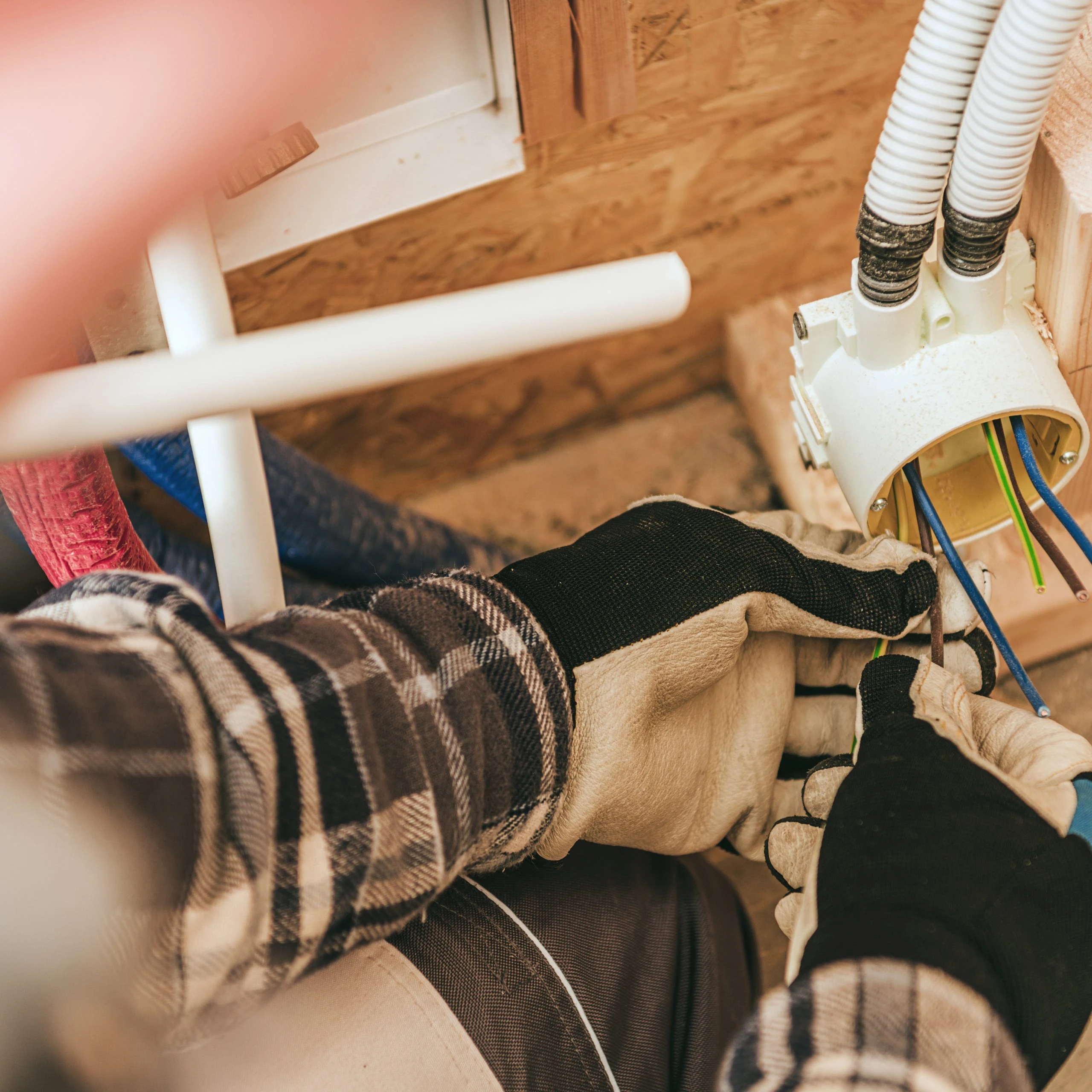 Kansas City electrician installing wall outlet safely